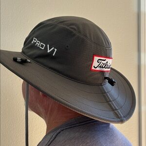 Titleist FJ Aussie golf hat, adjustable head and chin straps.